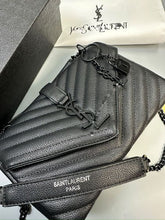 Load image into Gallery viewer, Saint Laurent black quilted leather crossbody bag with YSL logo, gold chain strap, and padlock charm, displayed with original packaging