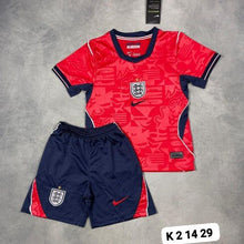 Load image into Gallery viewer, White Nike England national team football kit for children, showing short-sleeved jersey and shorts with red side panels and navy trim.