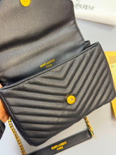 Load image into Gallery viewer, Saint Laurent black quilted leather crossbody bag with YSL logo, gold chain strap, and padlock charm, displayed with original packaging
