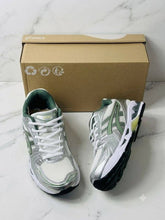 Load image into Gallery viewer, Asics white mesh running trainers with black and green accents shown from side and bottom sole view on marble surface.