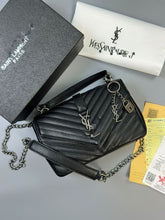 Load image into Gallery viewer, Saint Laurent black quilted leather crossbody bag with YSL logo, gold chain strap, and padlock charm, displayed with original packaging