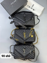Load image into Gallery viewer, Saint Laurent black quilted leather crossbody bag with YSL logo, gold chain strap, and padlock charm, displayed with original packaging